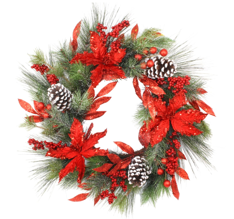 Red poinsettia wreath with snow dusted pinecones and red baubles set amongst pine. 